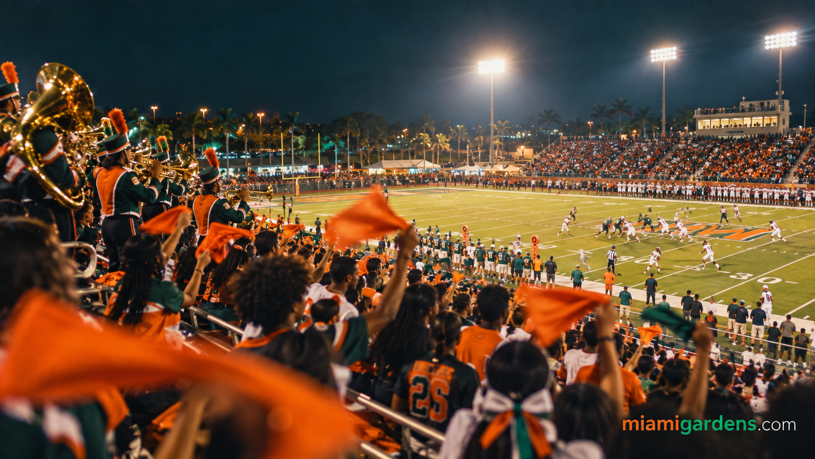 High school football players and a packed home crowd under stadium lights